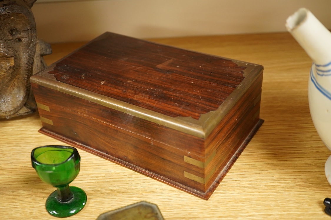 A carving of a Tudor rose-30cm wide, a brass bound box, small brass box, two eye baths, a green malachite ashtray etc